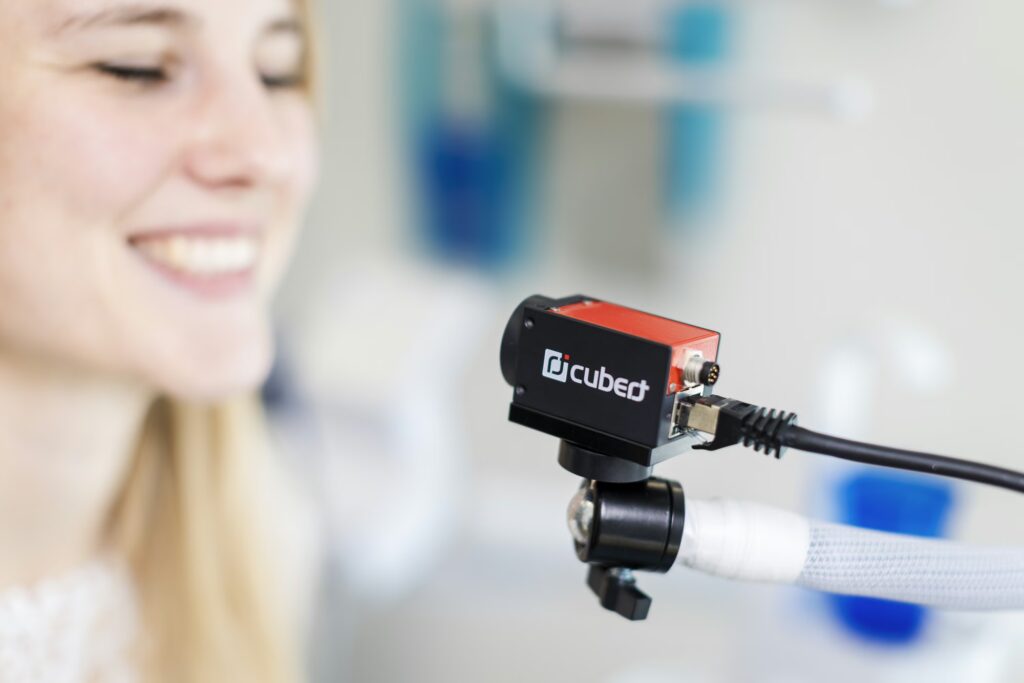 Cubert hyperspectral camera smiling woman laboratory