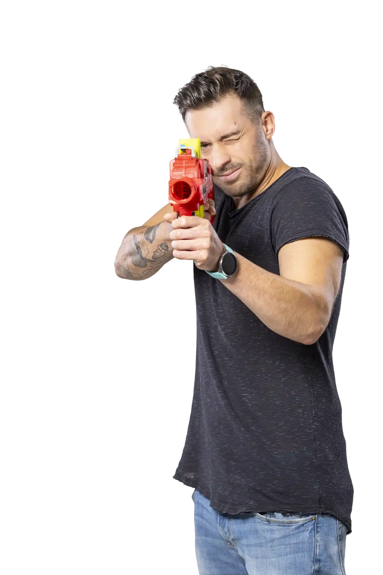Man holding red water gun aiming at camera